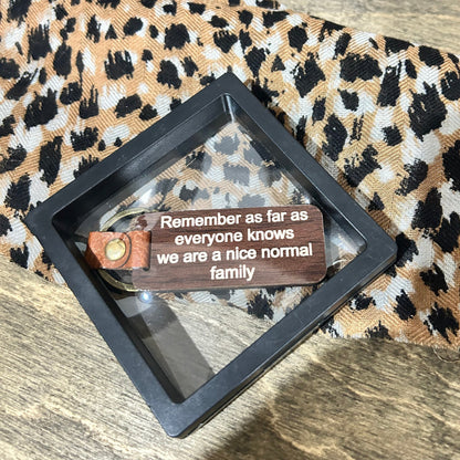 Remember… We are a Nice Normal Family Timber Key Tag